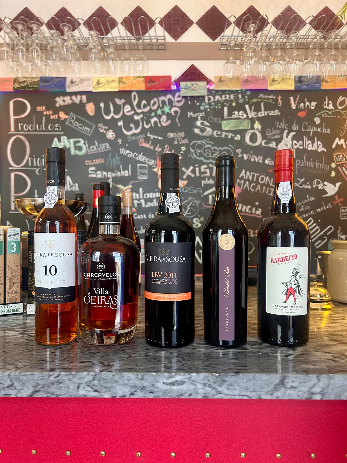 White, Tawny and LBV Port bottles lined up for a Port wine tasting in Lisbon