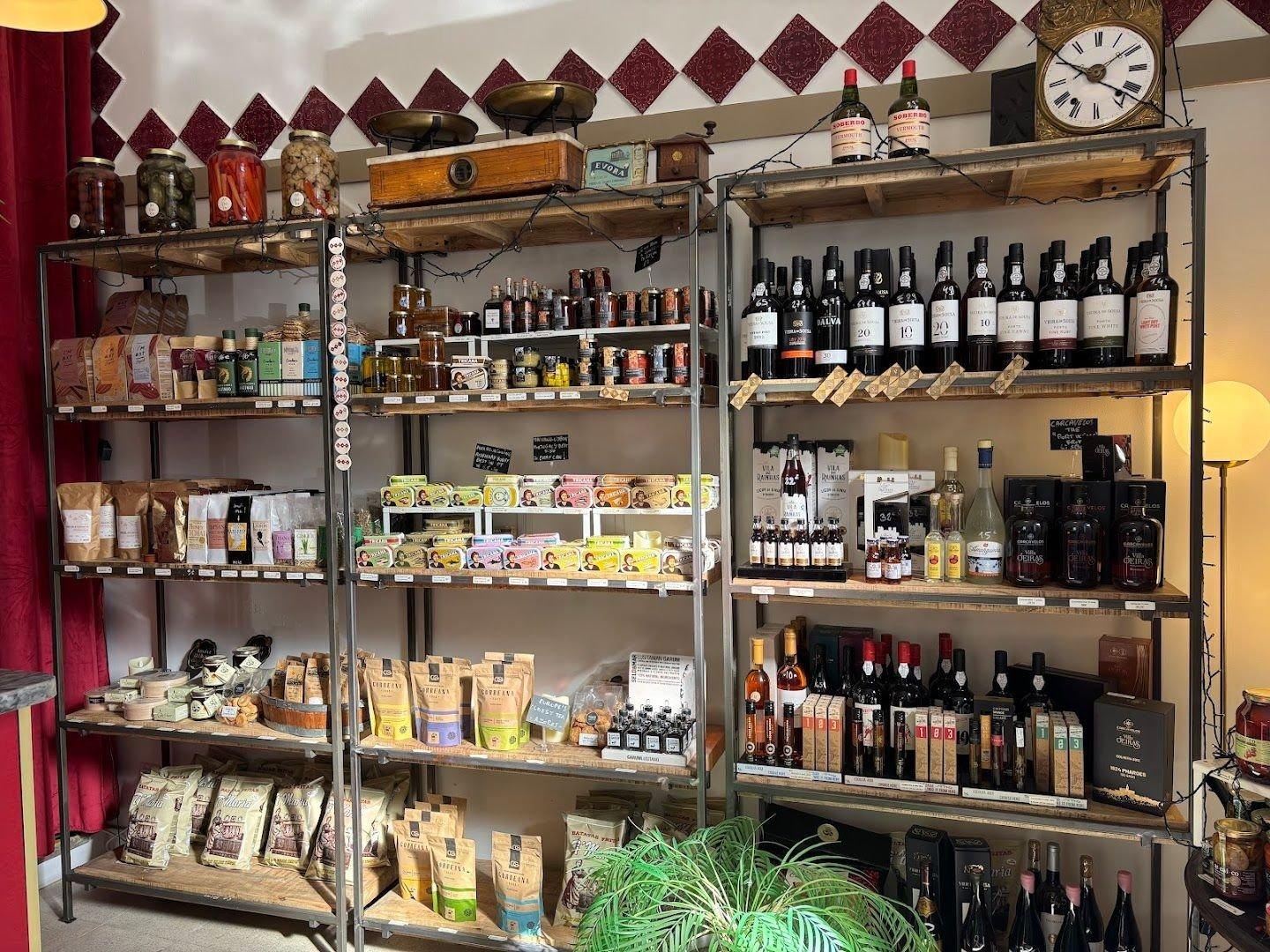 Port bottles and Portuguese gourmet products on the shelves of POP in Graça, Lisbon